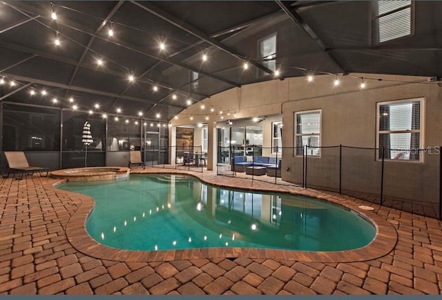 view of pool with a patio area and an in ground hot tub