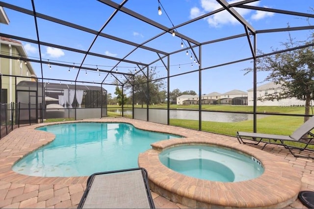 view of pool featuring glass enclosure, a water view, a yard, and an in ground hot tub