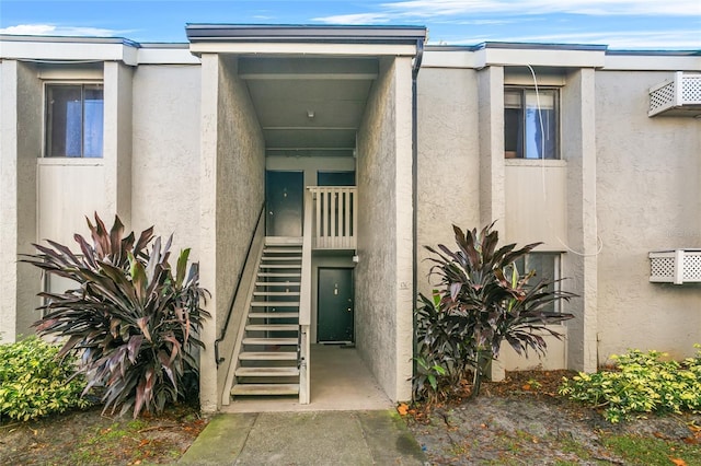 136 Springwood Cir Unit E, Longwood, FL 32750 - doorway to property with stucco siding