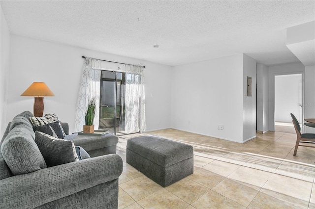 living room with light tile patterned floors and a textured ceiling