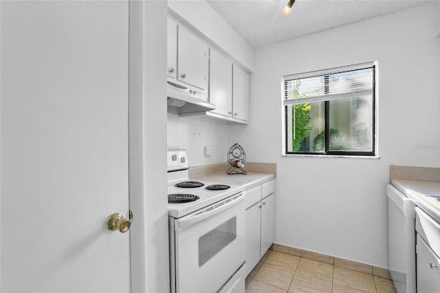 kitchen with light tile patterned flooring, a textured ceiling, white cabinetry, and electric stove