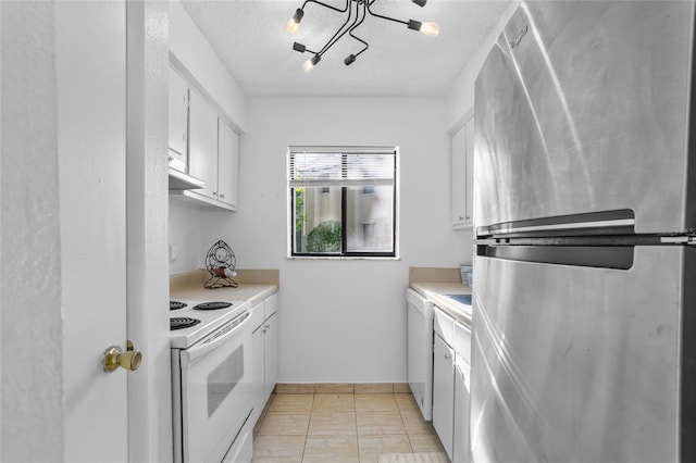 kitchen with white range with electric stovetop, stainless steel refrigerator, white cabinetry, and a textured ceiling