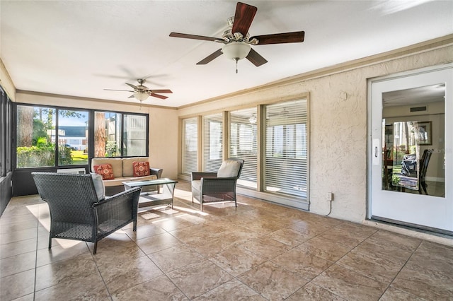 sunroom / solarium with ceiling fan