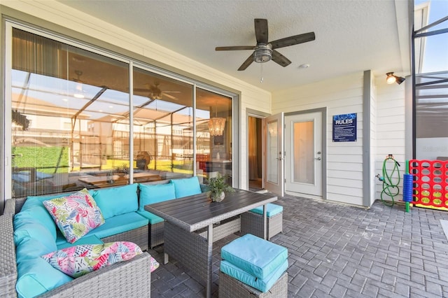 sunroom with ceiling fan