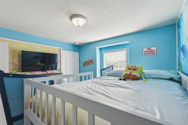 bedroom featuring a textured ceiling