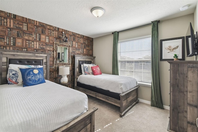 carpeted bedroom featuring a textured ceiling