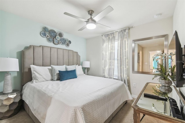 carpeted bedroom featuring ceiling fan