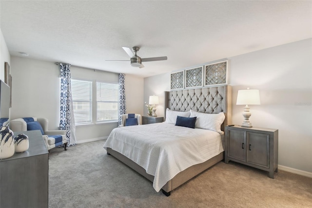 bedroom with light carpet and ceiling fan