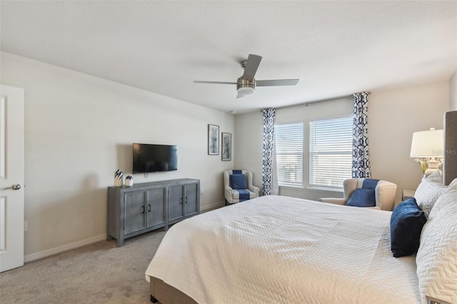 bedroom featuring light carpet and ceiling fan