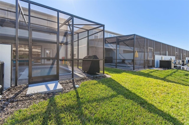 view of yard with a patio and a lanai