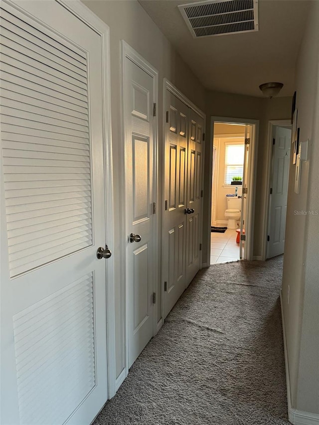 hallway with light carpet