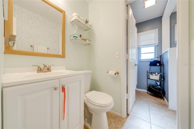 bathroom with tile patterned floors, vanity, and toilet