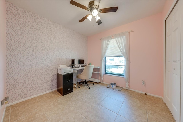 tiled office space featuring ceiling fan