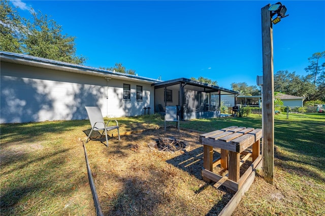 view of yard with a sunroom