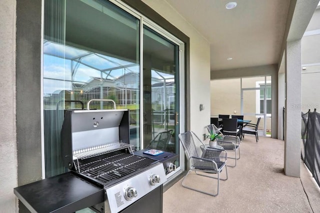 view of patio / terrace featuring a lanai