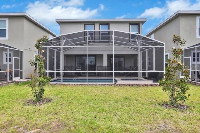 8932 Cabot Cliffs Dr, Davenport, FL 33896 - back of house featuring stucco siding, a lawn, an outdoor pool, and a lanai