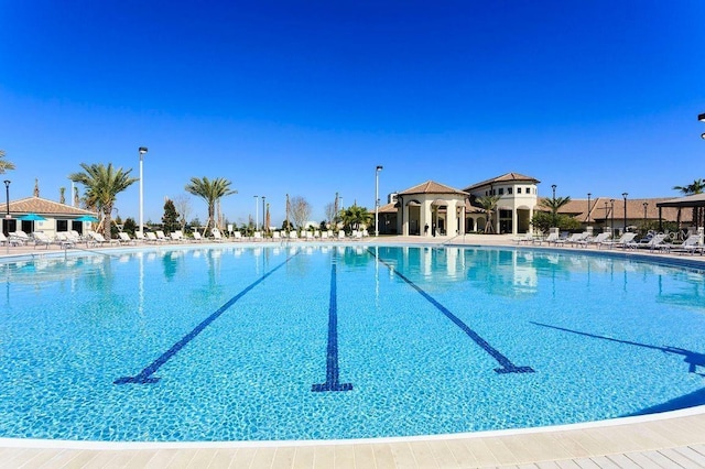 8932 Cabot Cliffs Dr, Davenport, FL 33896 - community pool featuring a gazebo