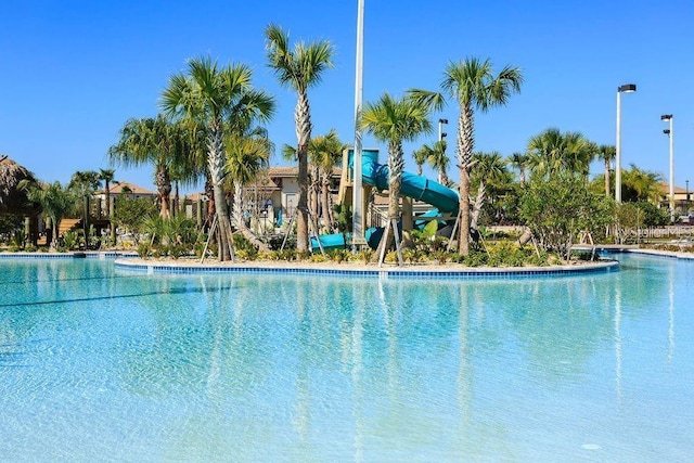 8932 Cabot Cliffs Dr, Davenport, FL 33896 - community pool featuring a water slide