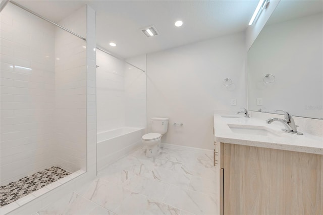 bathroom featuring a shower, vanity, and toilet