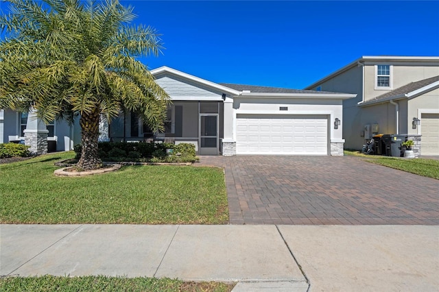 view of front of home featuring a garage and a front lawn