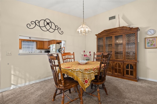 5846 Greenbriar Ct, Zephyrhills, FL 33542 - dining space with a chandelier and carpet flooring