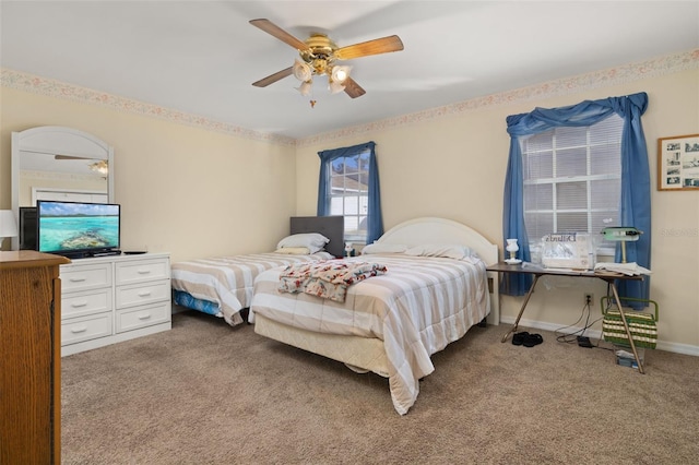 5846 Greenbriar Ct, Zephyrhills, FL 33542 - carpeted bedroom with a ceiling fan and baseboards