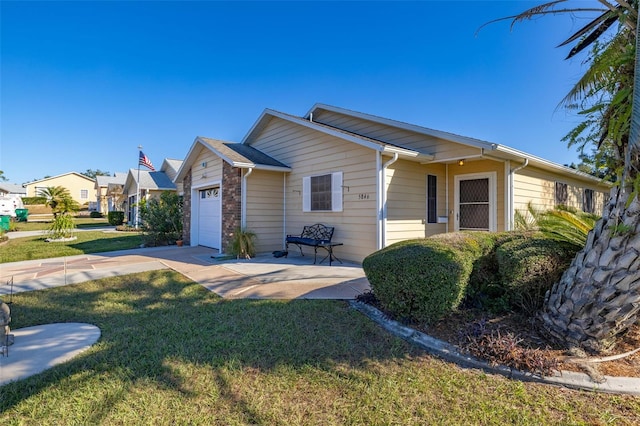 ranch-style home with a garage and a front yard