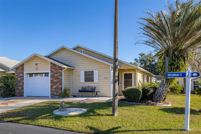 single story home featuring a garage and a front lawn