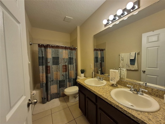 full bathroom with shower / bath combination with curtain, tile patterned floors, a textured ceiling, vanity, and toilet