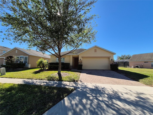 single story home featuring a front yard and a garage