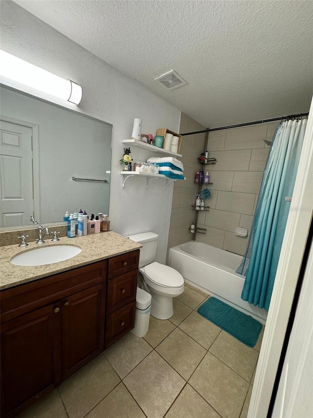 full bathroom featuring shower / tub combo, a textured ceiling, vanity, tile patterned flooring, and toilet