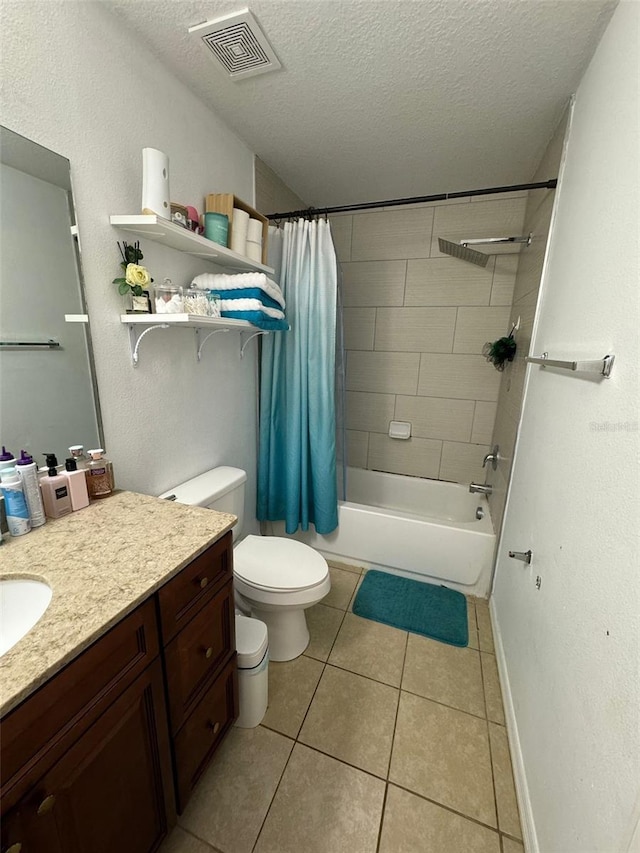 full bathroom with shower / tub combo, vanity, a textured ceiling, tile patterned flooring, and toilet