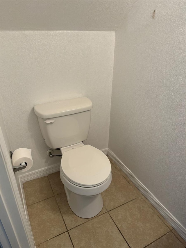 bathroom featuring tile patterned floors and toilet