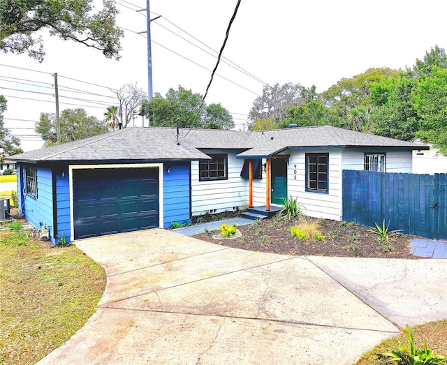 single story home featuring a garage and central air condition unit