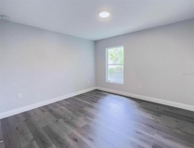 empty room featuring dark hardwood / wood-style floors