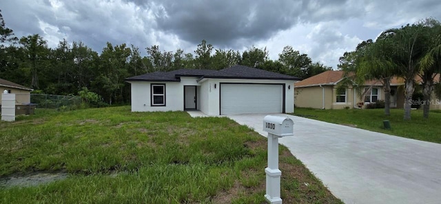 1030 Darlington Ct, Kissimmee, FL 34758 - view of front of house with driveway, an attached garage, and stucco siding