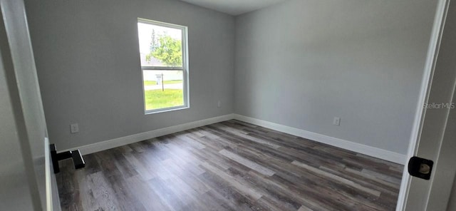 1030 Darlington Ct, Kissimmee, FL 34758 - unfurnished room with plenty of natural light and dark wood-style flooring