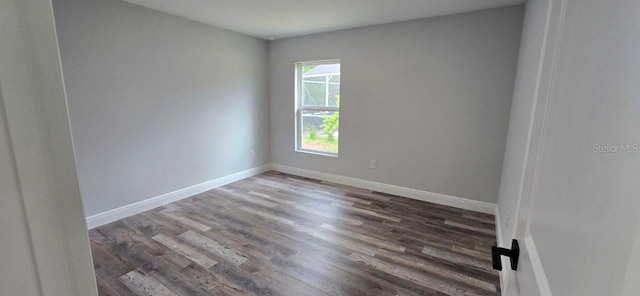 1030 Darlington Ct, Kissimmee, FL 34758 - spare room featuring wood finished floors and baseboards