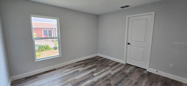1030 Darlington Ct, Kissimmee, FL 34758 - empty room featuring plenty of natural light and wood finished floors