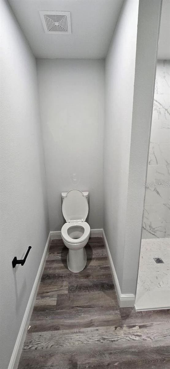 1030 Darlington Ct, Kissimmee, FL 34758 - full bath featuring a stall shower and wood finished floors