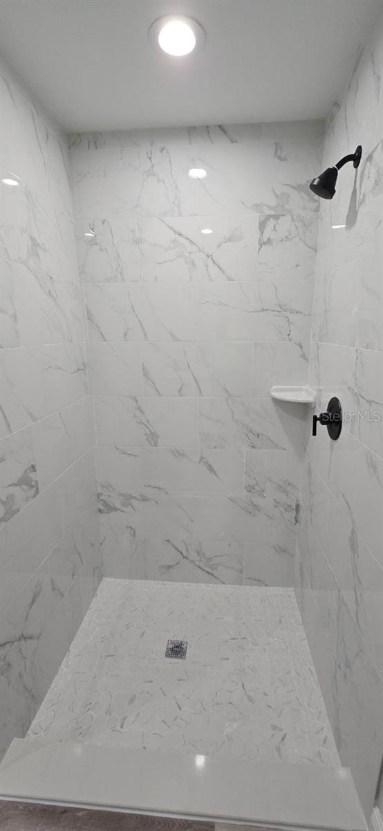 1030 Darlington Ct, Kissimmee, FL 34758 - full bathroom featuring a marble finish shower