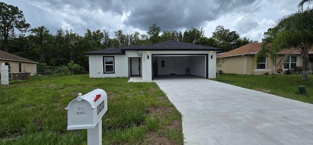 1030 Darlington Ct, Kissimmee, FL 34758 - view of front of home featuring a garage, concrete driveway, and stucco siding