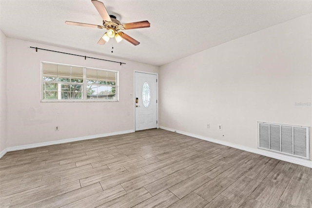 interior space featuring ceiling fan, a wealth of natural light, and light hardwood / wood-style flooring