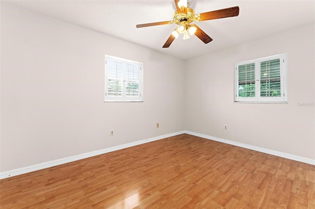 spare room featuring ceiling fan and light hardwood / wood-style flooring