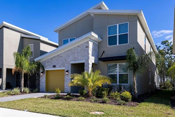 modern home featuring a front lawn