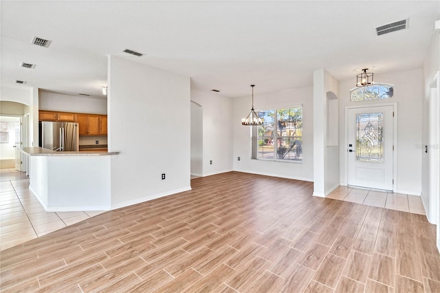 interior space featuring an inviting chandelier