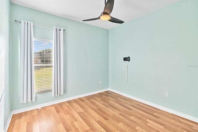 empty room with light wood-type flooring and ceiling fan