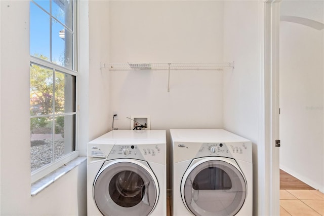 laundry area featuring separate washer and dryer and tile patterned floors