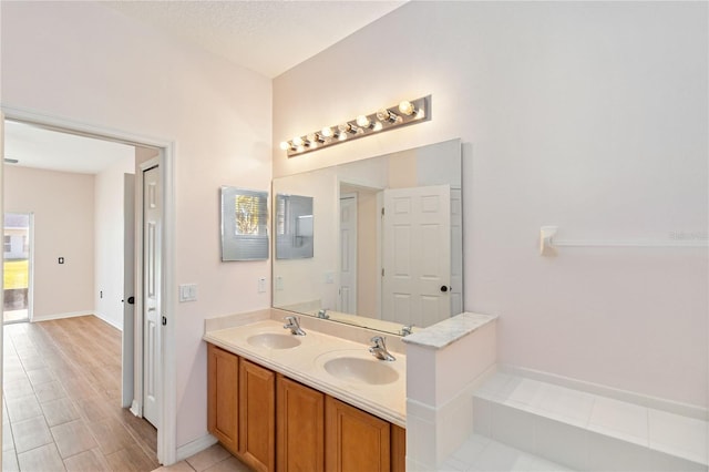 bathroom featuring vanity and a textured ceiling