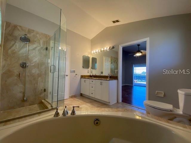 full bathroom featuring ceiling fan, vaulted ceiling, toilet, vanity, and independent shower and bath